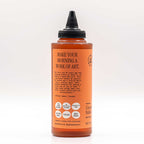 Side view of the bottle featuring the "Make Your Morning a Work of Art" quote and dietary badges.